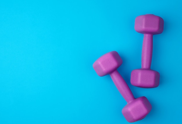 Pair of purple plastic dumbbells,