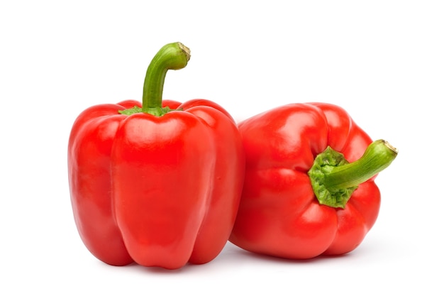 Pair of Red bell peppers isolated on white