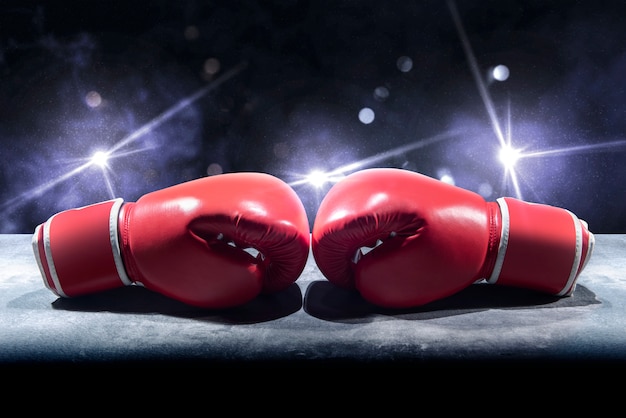 Pair of red boxing gloves on the table