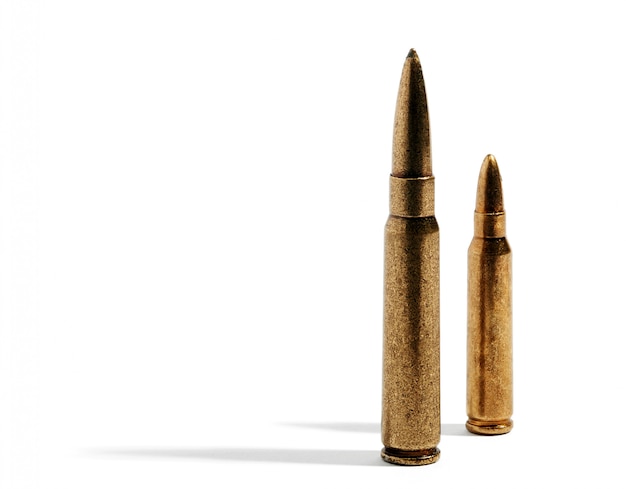 Pair of rifle bullets over white