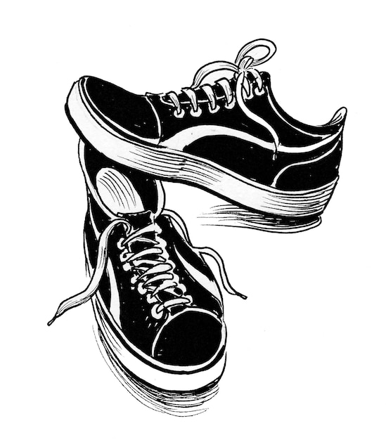 Pair of sport shoes. Ink black and white drawing