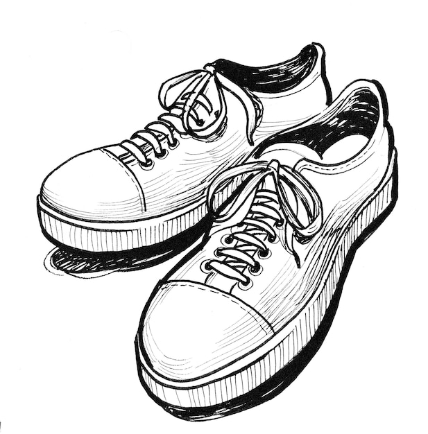 Pair of sport shoes. Ink black and white drawing