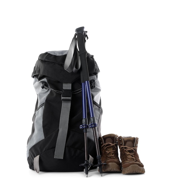 Photo pair of trekking poles and camping equipment for tourism on white background