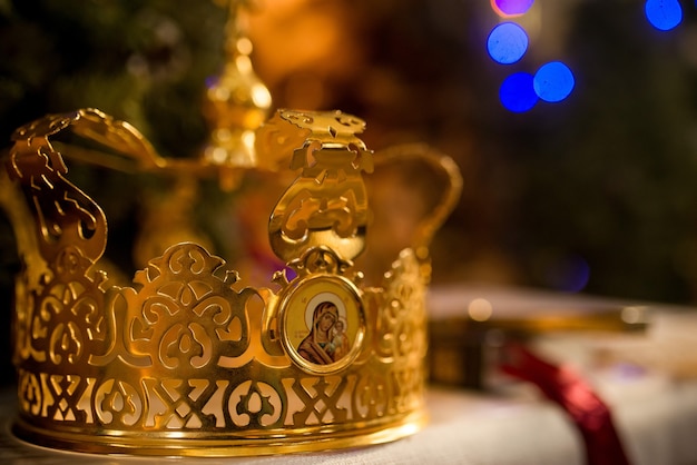 A pair of two golden crowns for weddings, weddings in the church temple at the divine liturgy ceremony