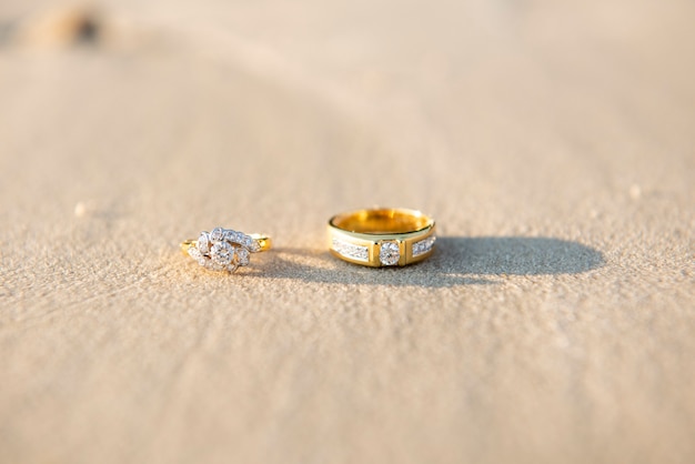 pair of wedding ring on beach 