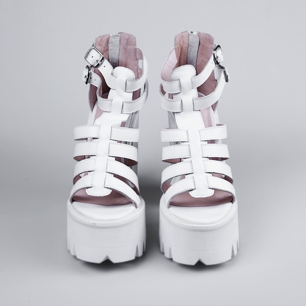 Pair of white high heel shoes