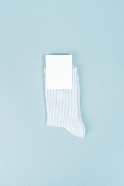 Pair of white socks with blank labels. mockup with blank label