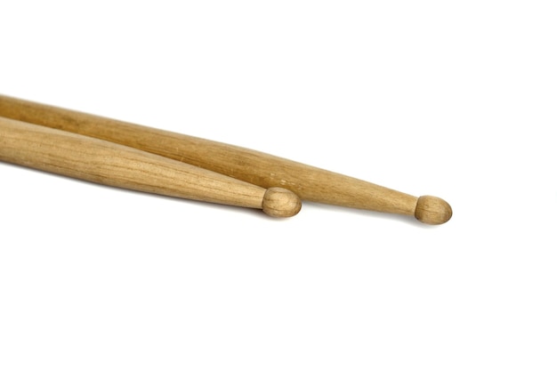 A pair of wooden drumsticks isolated on a white background