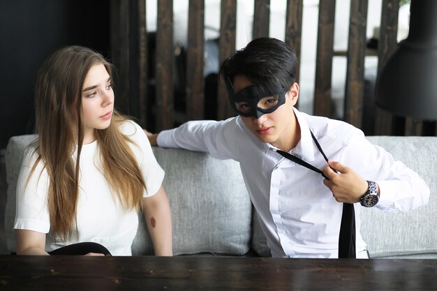 A pair of young people talking at the office