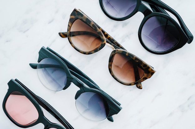 Pairs of round sunglasses on a white background