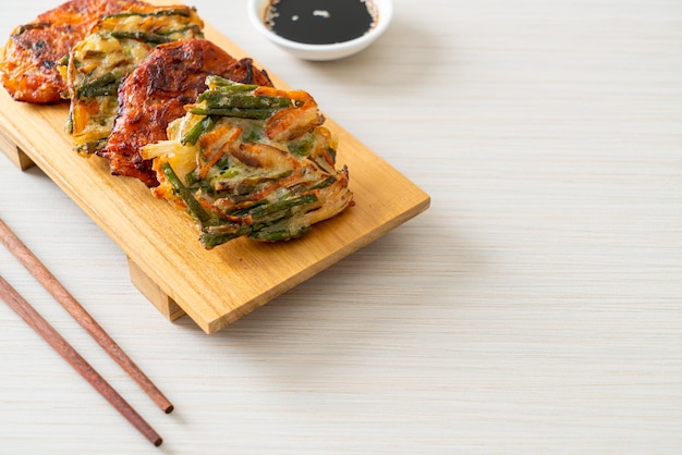 Pajeon or Korean pancake and Korean Kimchi pancake or Kimchijeon on white background