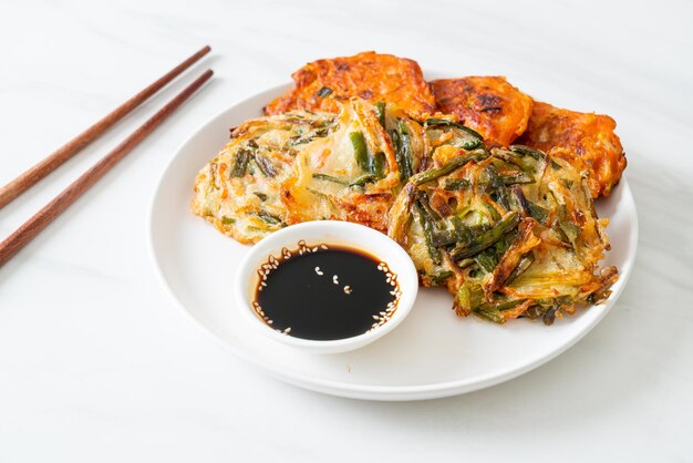 Pajeon or Korean pancake and Korean Kimchi pancake or Kimchijeon on white background