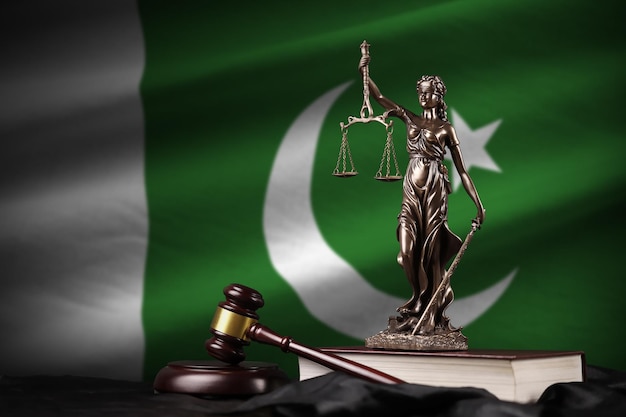 Pakistan flag with statue of lady justice constitution and judge hammer on black drapery concept of