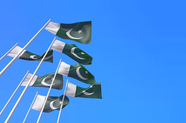 Pakistan flags waving in the wind against a blue sky d rendering