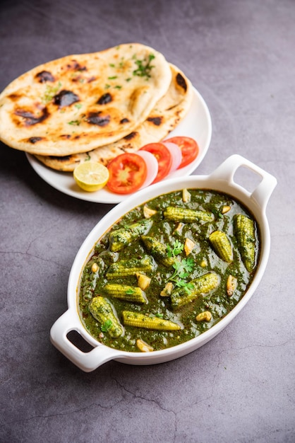 palak baby corn sabzi also known as spinach makai curry served with rice or roti Indian food