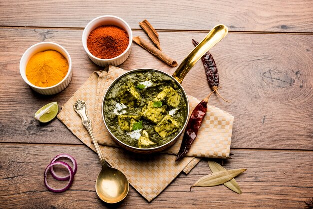 Palak Paneer Curry made up of spinach and cottage cheese served in a bowl or pan with roti or rice