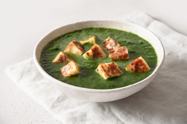 Palak paneer on white