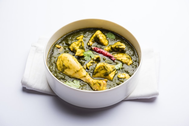 Palak or spinach Chicken or Murg Saagwala served in a bowl with Naan and rice