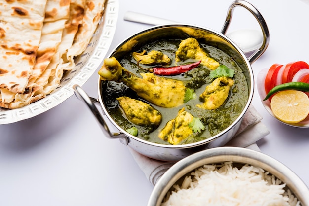 Palak or spinach Chicken or Murg Saagwala served in a bowl with Naan and rice