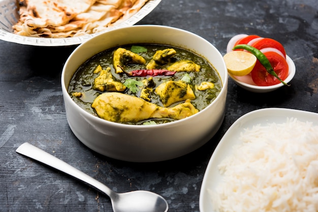 Palak or spinach Chicken or Murg Saagwala served in a bowl with Naan and rice