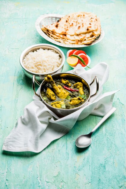 Palak or spinach Chicken or Murg Saagwala served in a bowl with Naan and rice