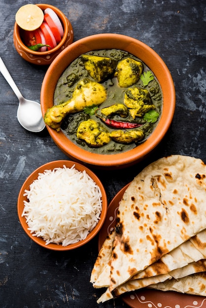 Palak or spinach Chicken or Murg Saagwala served in a bowl with Naan and rice