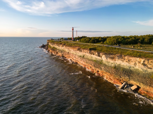 Paldiski peninsula at sunset in summer an old lighthouse on a cliff in the Baltic Sea