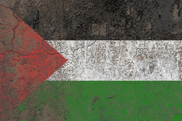 Palestine flag painted on a damaged old concrete wall surface