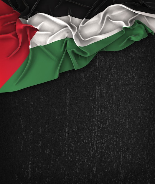 Palestina flag vintage su una lavagna nera grunge con spazio per il testo