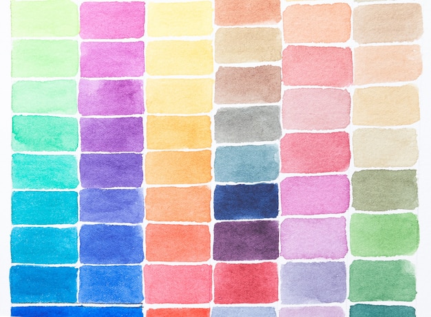 写真 白い紙に描かれた色合いの水彩画の異なる色のパレット