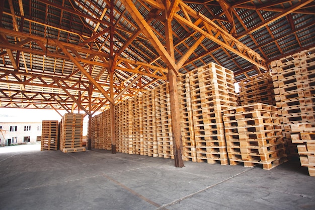 The pallets are located in the middle of the warehouse