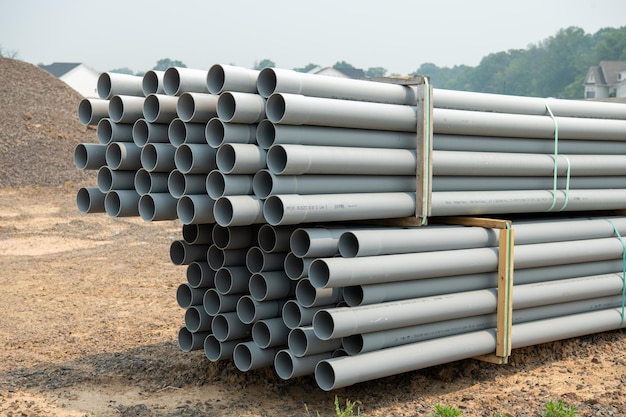 Pallets of sewer pipes at construction site