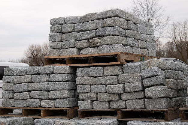 Pallets with natural facing stone and cobblestones