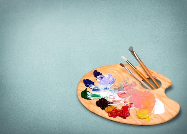 pallette with brushes on a white background