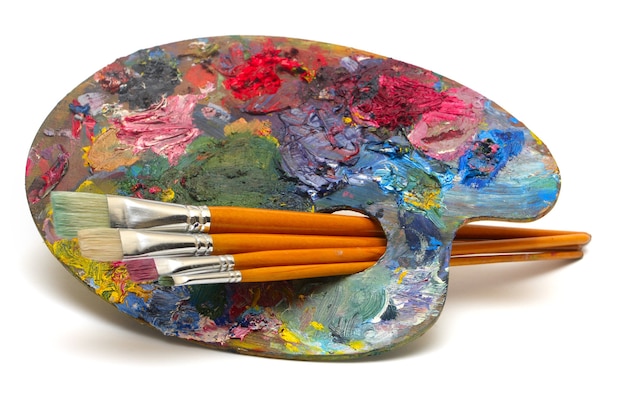 pallette with brushes on a white background