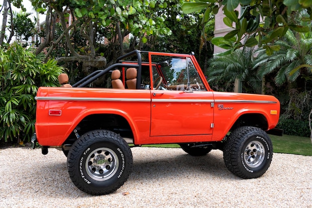 Palm Beach Florida USA March 21 2021 orange red Ford Bronco sport cabriolet tuned car parked in palm beach united states of america side view