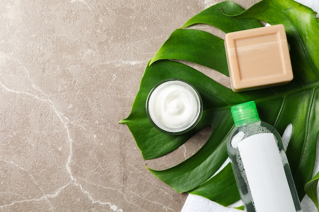 Palm leaf, cream, soap, shampoo and towel