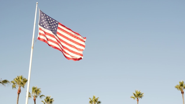 Palm trees and american flag, Los Angeles, California USA. Star Spangled Banner, Stars and Stripes