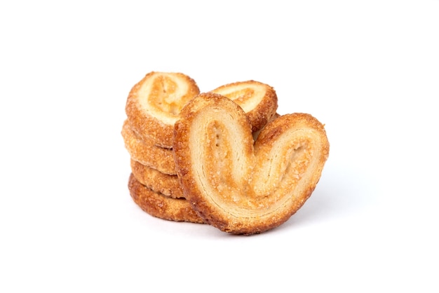 Palmier cookies or puff pastry ears isolated on white.