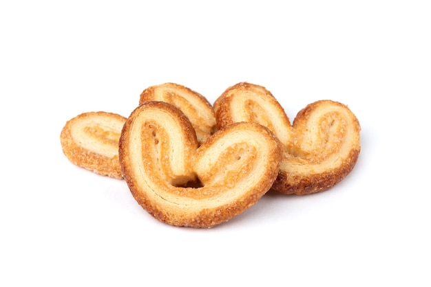 Palmier cookies or puff pastry ears isolated on white.