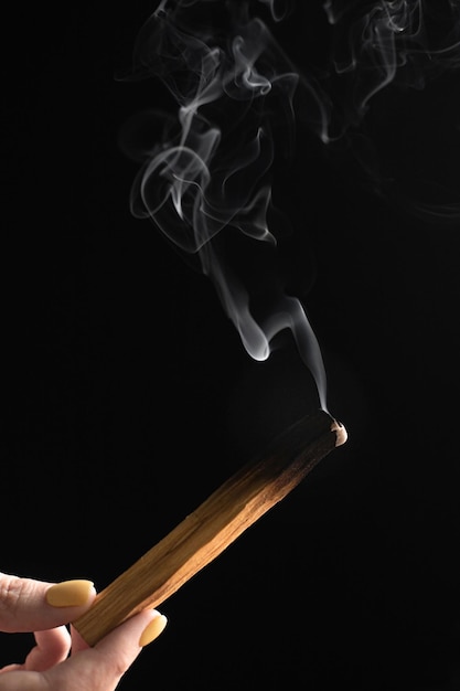 palo santo stick with smoke