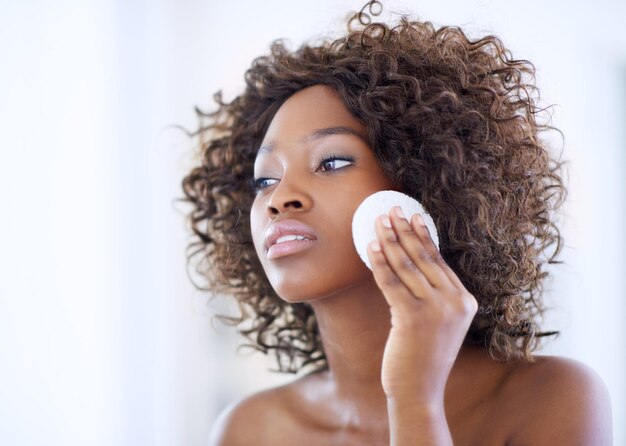 Pamper your skin Shot of a beautiful young woman during her daily beauty routine