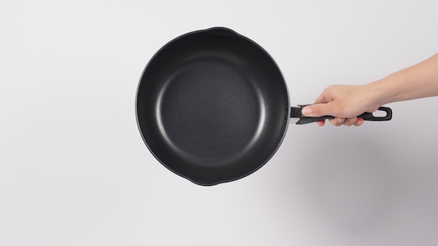 pan cleaning man hand on white background cleaning the non stick pan with handy dish washing sponge