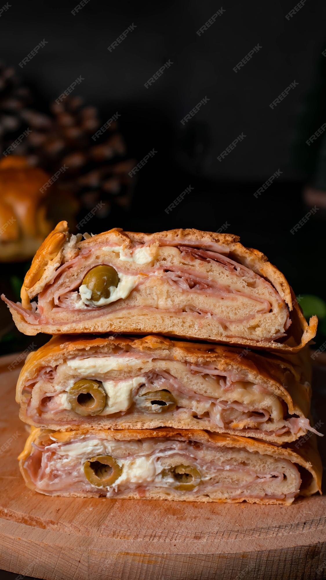 Venezuelan cuisine: Christmas loaf pan de jamon close-up. Vertical