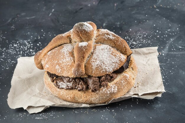 Pan de muerto with typical Mexican food