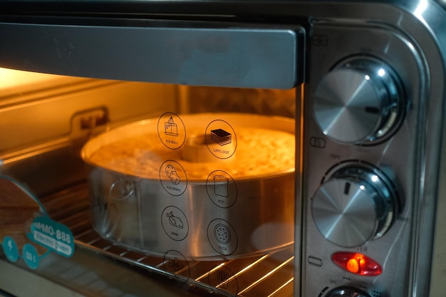 A pan of food is being cooked in an oven.