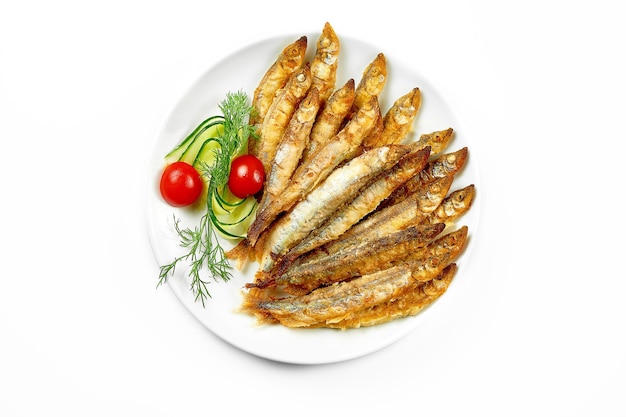 Pan fried crispy smelt closeup Closeup selective focus White background