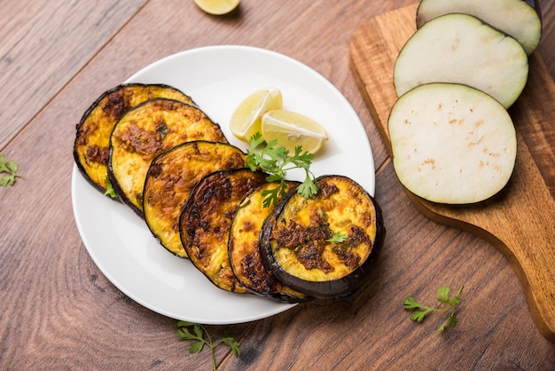 Pan fry crispy baigan or eggplant or brinjal recipe from India. selective focus