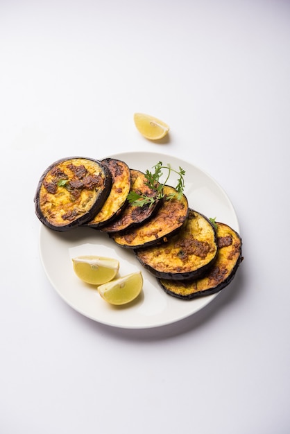 Pan fry crispy baigan or eggplant or brinjal recipe from India. selective focus