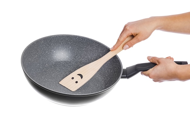 Pan in hands on a white background